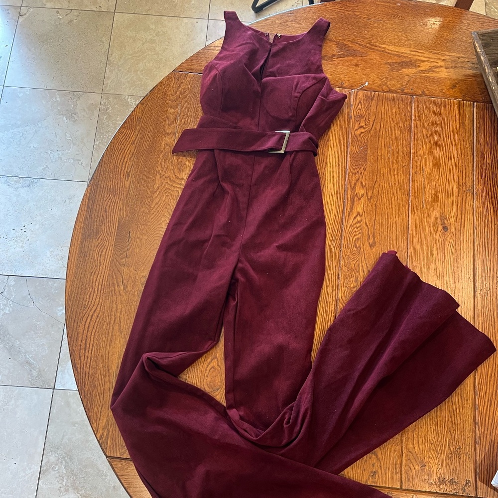 Maslavi  (jovani ready to wear)Burgundy suede jumpsuit.  Flared leg Size 8